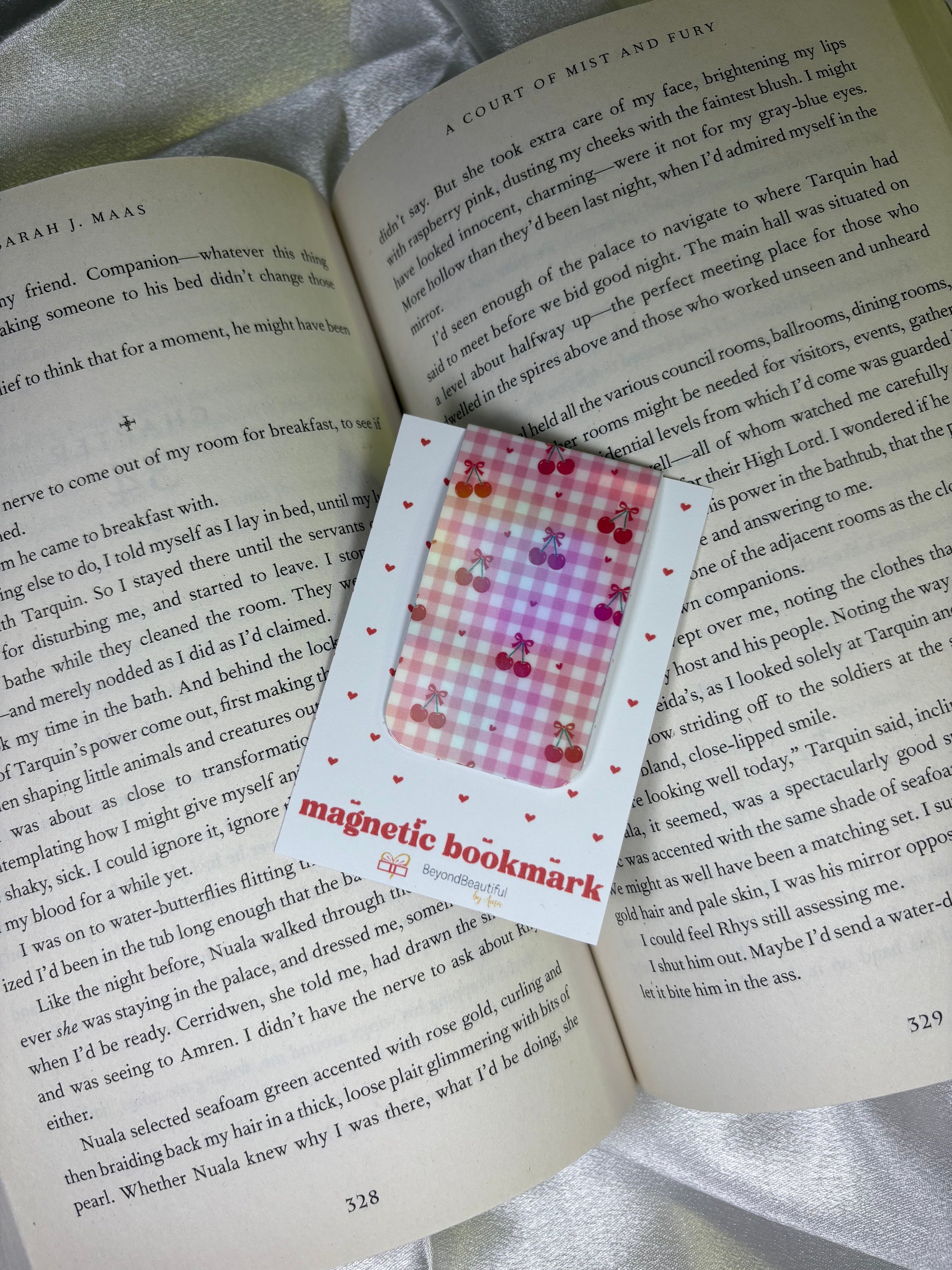 Magnetic bookmark with colorful design on an open book