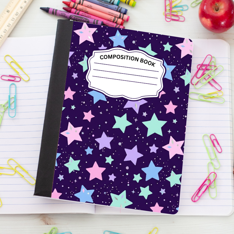 A composition book with a dark purple starry space cover pattern, placed on an open lined notebook surrounded by school supplies like colored paperclips, crayons, a ruler, and an apple.